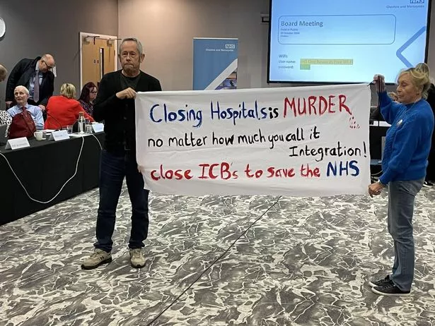 Protesters hold up a sign at a rally about the future of Liverpool Women's Hospital